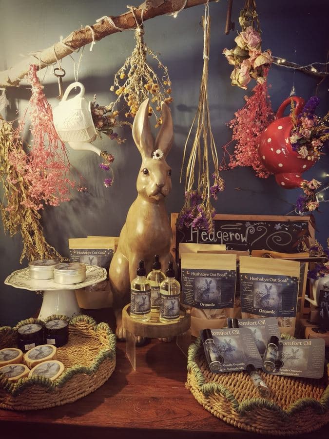 Ruby & Elm Hedgerow display with brass hare and hand-made products